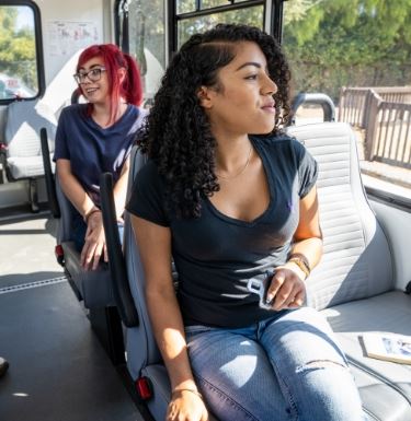 New Image View of girl sitting on bus